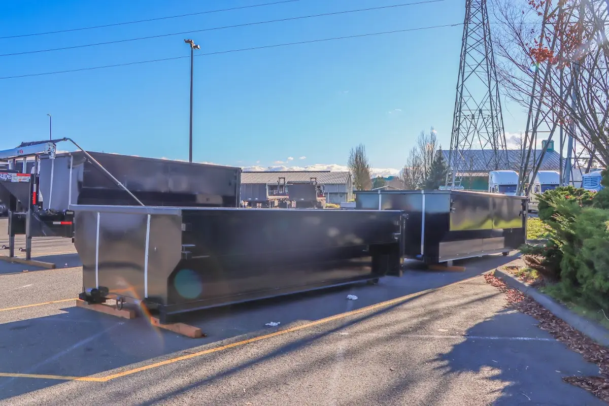 Roll-off dumpster ready for waste disposal at job site for 2 Yard Dumpster Rental in Pearl